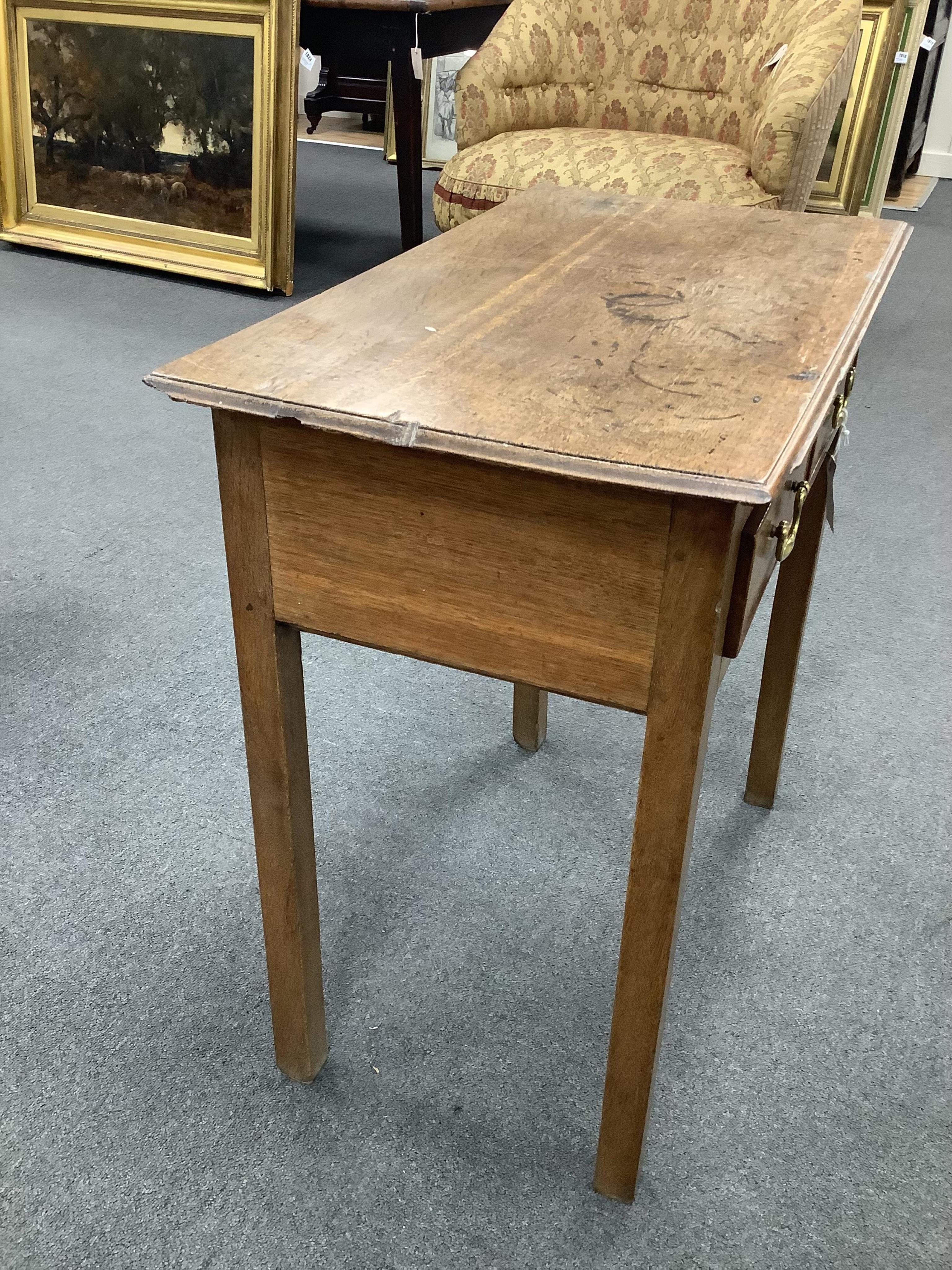 A small 18th century oak two drawer side table, width 69cm, depth 39cm, height 70cm. Condition - poor to fair